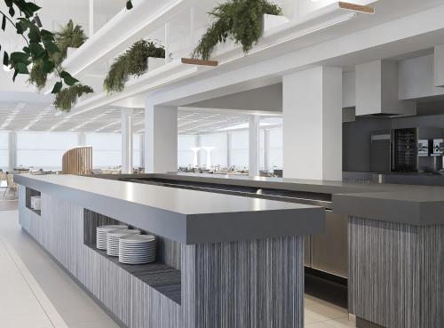 a kitchen with a large counter with plates on it at Porto Platanias Beach Luxury Selection - Adults Only in Plataniás