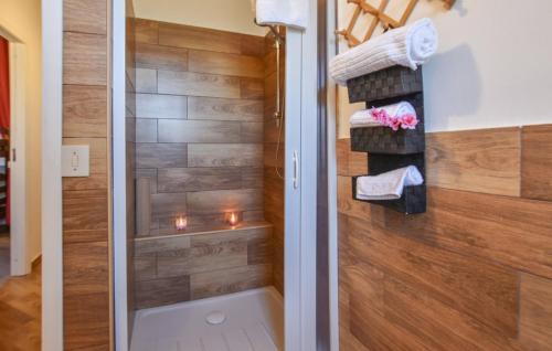 a bathroom with a shower with a toilet and towels at Villa Trappeto in Trappeto
