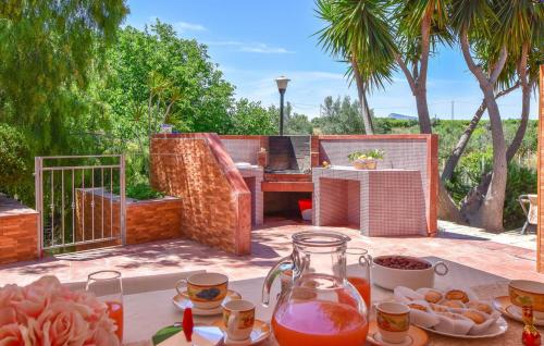 a table with food and drinks on a patio at Villa Trappeto in Trappeto