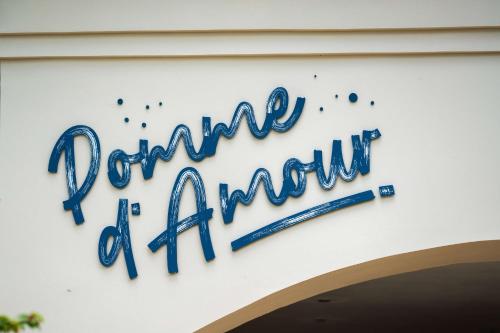 a sign on the side of a building with a baseball bat at Hilton Mauritius Resort & Spa in Flic-en-Flac