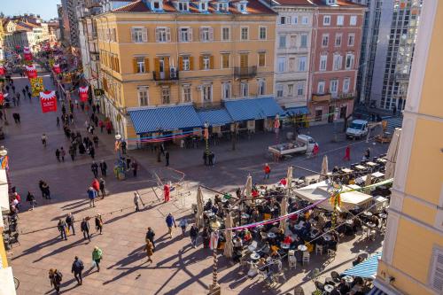 an overhead view of a busy city street with people at Molo Longo - Downtown Apartments in Rijeka