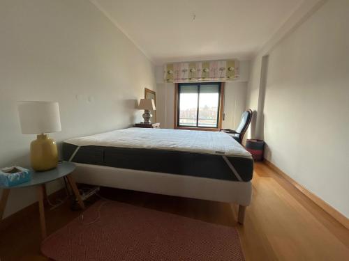 Una cama o camas en una habitación de Proximité de Lisbonne et des plages