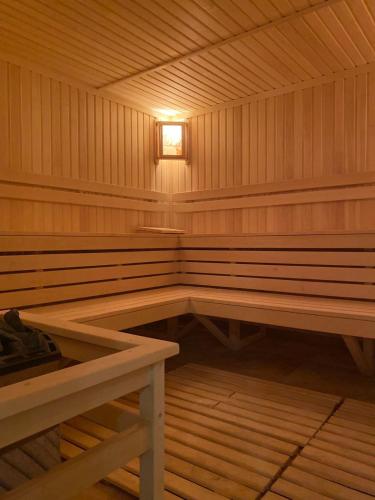 an empty wooden sauna with a light in it at Apartroom in Tsaghkadzor