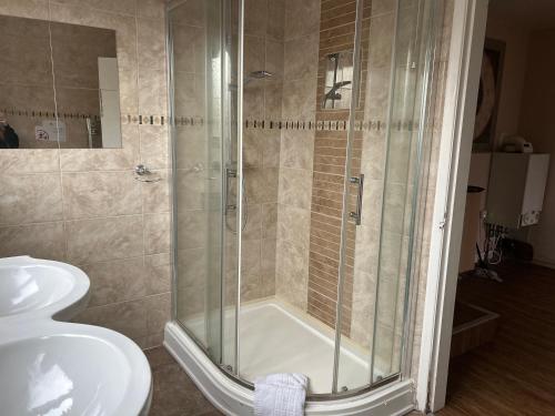 Ένα μπάνιο στο Guest Suite at The Grand Hotel