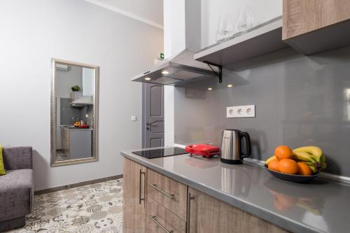 a kitchen with a bowl of fruit on a counter at Molo Longo - Downtown Apartments in Rijeka