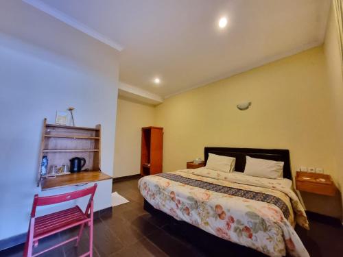 Кровать или кровати в номере The Swarna Hotel Bayah Lebak