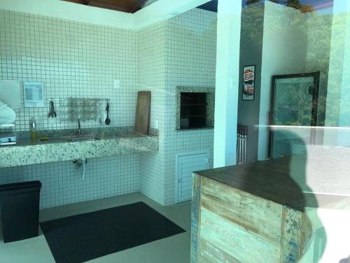 a bathroom with a sink and a toilet in a room at Apto top, a melhor vista de Balneário Camboriú! in Balneário Camboriú