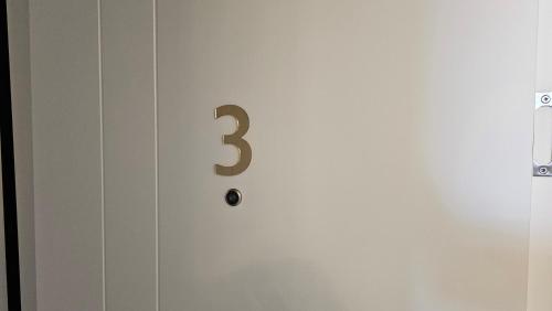a door with a number on it at HOTEL Casa Vacanze SHIROKE in Široka