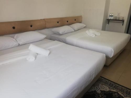 Postel nebo postele na pokoji v ubytování RIYAD HOTEL