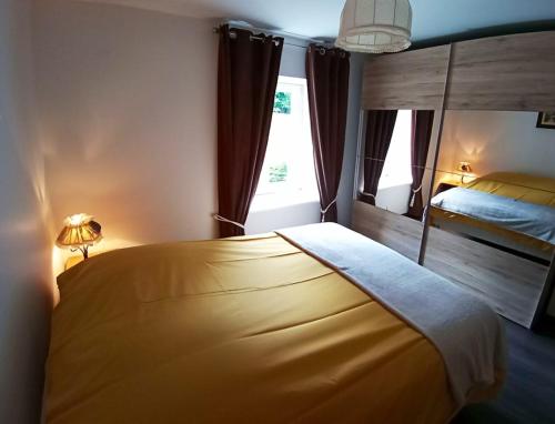 Кровать или кровати в номере Appartement de 2 chambres avec terrasse amenagee et wifi a Mittlach