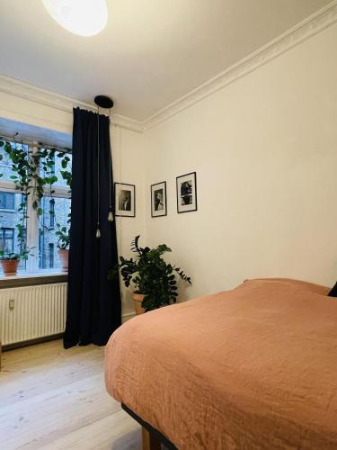 a bedroom with a bed and a window at ApartmentInCopenhagen Apartment 1584 in Copenhagen