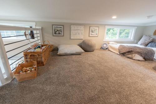 a living room with a bed and a couch at Pet friendly Tiny House Rental with new Access to Guadalupe River NBTX in New Braunfels