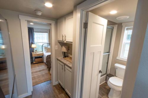 a small bathroom with a toilet and a sink at Pet friendly Tiny House Rental with new Access to Guadalupe River NBTX in New Braunfels