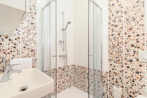 a bathroom with a sink and a shower at Villa Lelaina near Pula with private Pool and 3 km from the beach in Šegotići