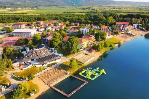 an aerial view of a small town on the river at Apartmani Royal in Veliko Gradište