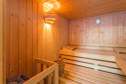 een houten hut met een sauna bij Villa Krase kids friendly for 10 persons near Rakalj with sauna - fitness & playground in Rakalj
