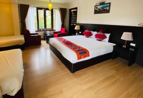Una cama o camas en una habitación de Sapa Elite Hotel