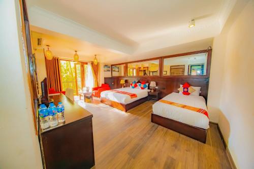 Una cama o camas en una habitación de Sapa Elite Hotel