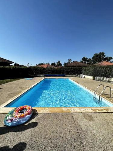 a swimming pool with at Pavillon de Standing - Parking Privé - Proche CERN/ONU/Genève in Prévessin-Moëns