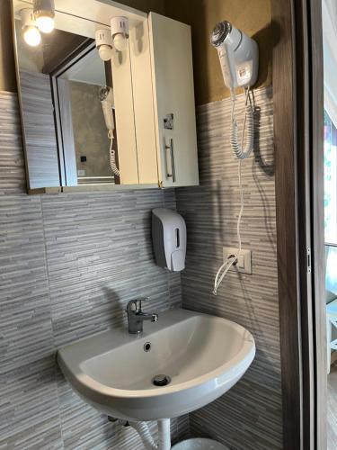 a bathroom with a sink and a mirror at Gloria Hostel Milano in Milan