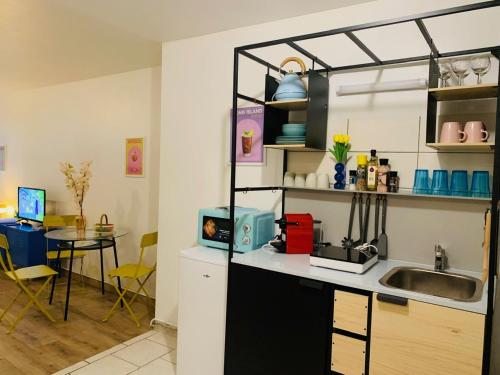 Kuchyň nebo kuchyňský kout v ubytování cocooning modern design studio