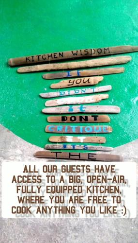 a group of wooden baseball bats on a green table at Happy Spiritus Guethouse Tabanan in Tabanan