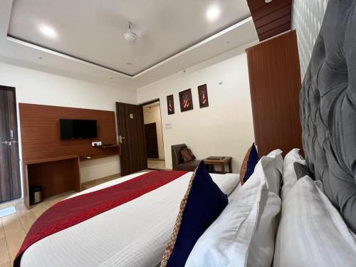 Un ou plusieurs lits dans un hébergement de l'établissement Darshan kashi