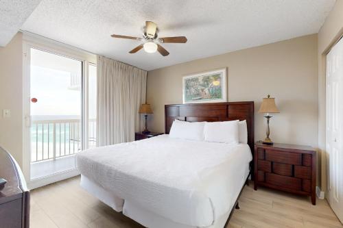 a bedroom with a bed and a ceiling fan at The Resorts Of Pelican Beach 1413 Destin (Condo) in Destin