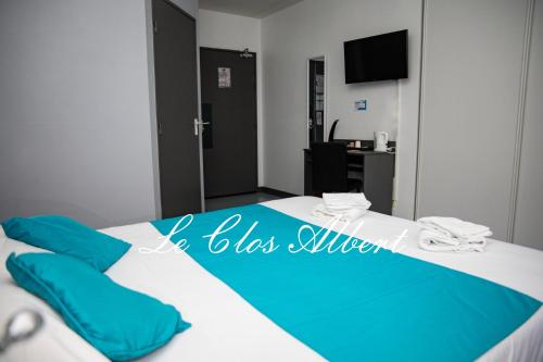 Postel nebo postele na pokoji v ubytování Le Clos Albert