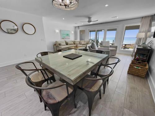 a dining room with a table and chairs at Three Steps to the Beach Townhouse in Inlet Beach