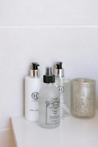 two bottles ofodorizers sitting on a shelf at La Roche Estate in Franschhoek