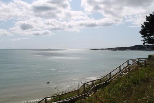 a view of a beach with a fence next to the water at Host & Stay - Old Harry Rocks in Swanage