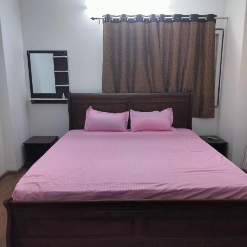 Кровать или кровати в номере Shiv Chhatra - Opp AIIMS