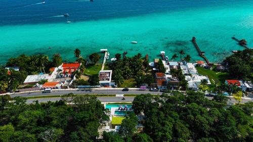 an aerial view of a town next to the ocean at Hotel & Eco Cabañas Azul María Bacalar- Gratis Club de playa in Bacalar