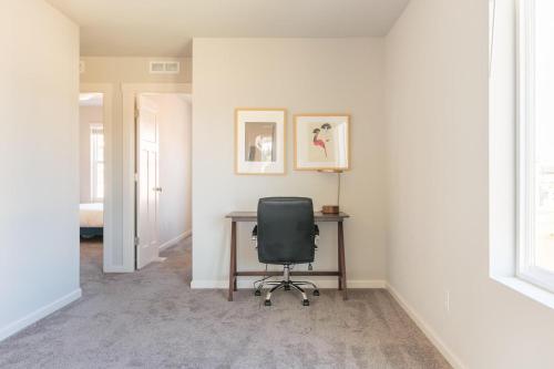 a desk with a black chair in a room at Hillsboro 2br close to park restaurants PDX-8 in Aloha