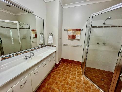 a bathroom with a sink and a shower at Riverside Boulevard 13-151 in Ross River
