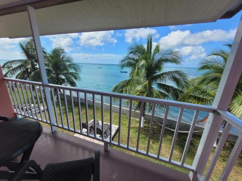 a view of the ocean from the balcony of a resort at HOTEL POSADA DEL MAR in Providencia