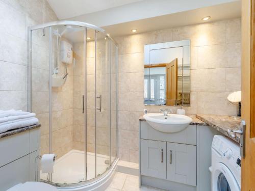 a bathroom with a shower and a sink at 3 Bed in Rowlands Gill 86802 in Stanley