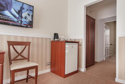 Consul Hotel Консулにあるテレビまたはエンターテインメントセンター