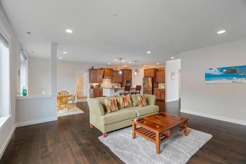 a living room with a couch and a table at Serenity Shores in Kenmore in Kenmore