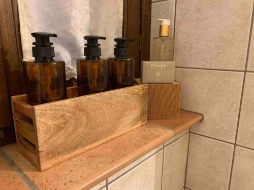 a group of four bottles sitting on a counter at Casa Aurora in San Potito