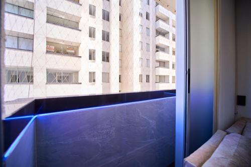 a window with a view of a building at Apartamentos Amoblados Confort Turismo en Cúcuta in Cúcuta