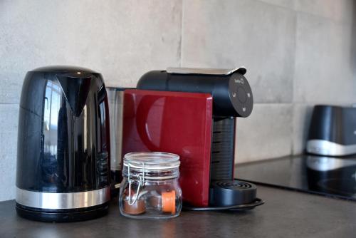 a coffee maker sitting on top of a counter at Over the Beach in Monte Gordo