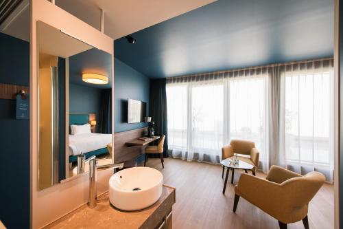 Coin salon dans l'établissement Hôtel de la Cité