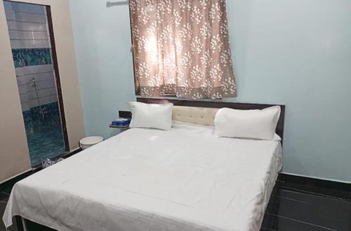 Krevet ili kreveti u jedinici u okviru objekta Hotal Raj Guest House