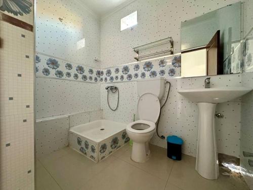 a bathroom with a toilet and a sink at Cidade Velha - Cathedral and Sea view - 1Bdr Apart - 2 in Cidade Velha