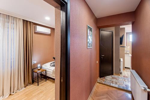 Postel nebo postele na pokoji v ubytování Apartment on Borbalo 16