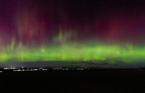 an image of the northern lights in the sky at Uisge Beatha in Dornoch