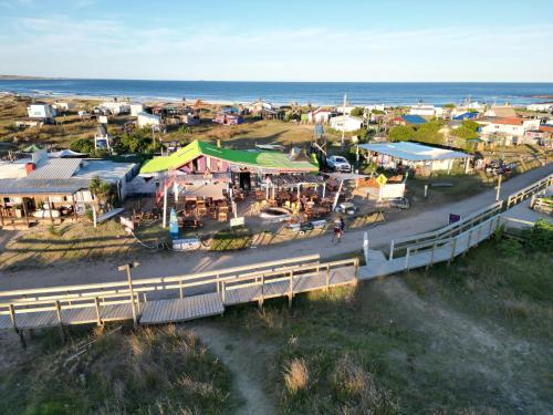 an aerial view of a small town with a bridge at Lobo Hostel Bar in Cabo Polonio