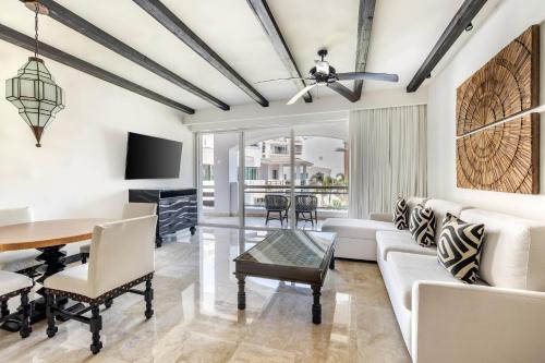 a living room with a table and a couch at Hilton Vacation Club Cabo Azul Los Cabos in San José del Cabo